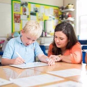 Image of pupil working with a teacher present - St George's School Windsor